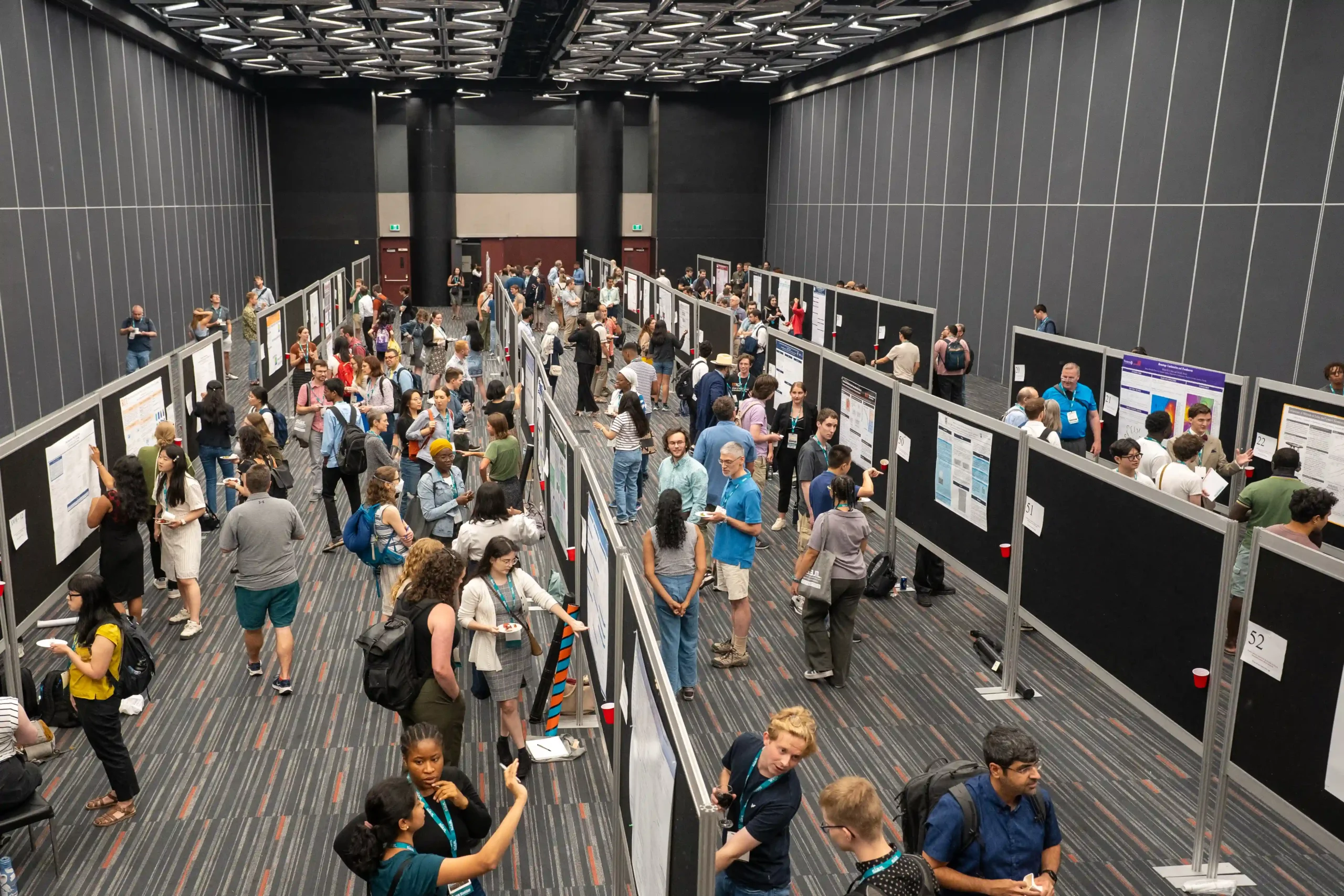 overlooking a conference hall with crowd of students