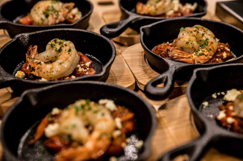 six pan filled with shrimp foods
