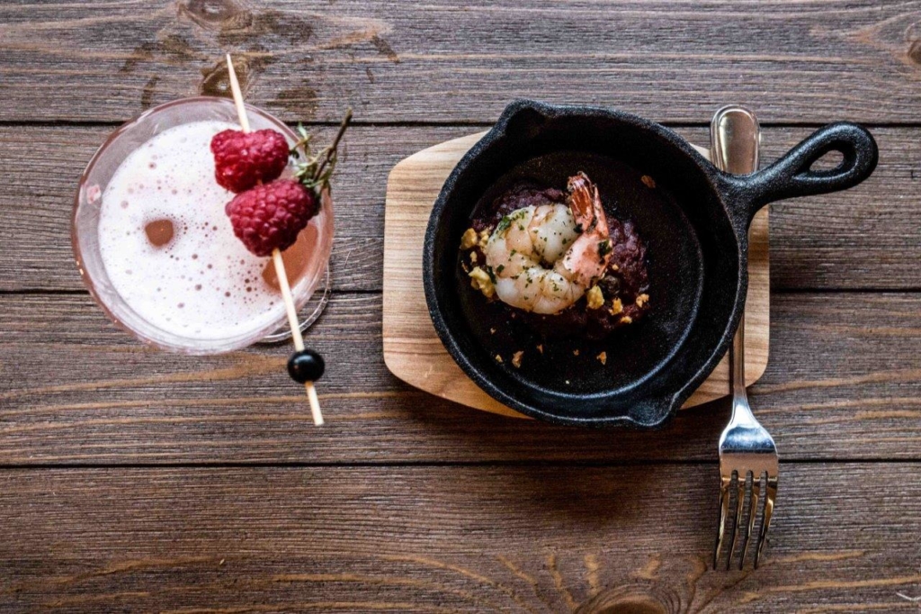 A plate of food sitting on top of a wooden table