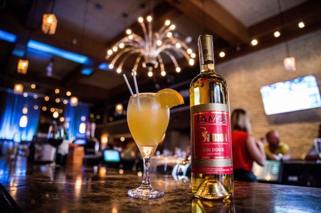 A glass of samos wines on a table for a corporate shoot