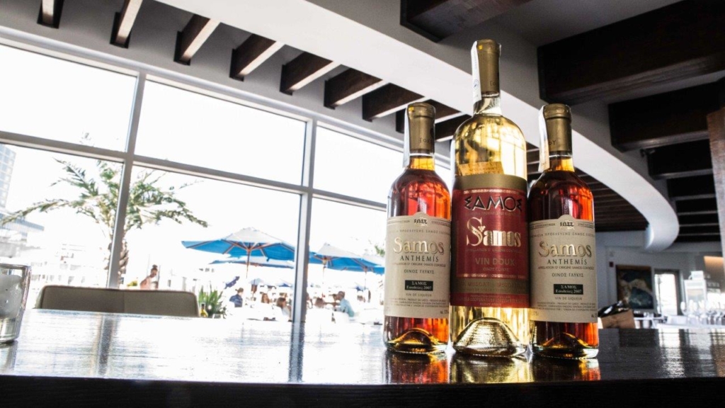 three bottle of samos wine on a bar at Skara cuisine mediterraneenne