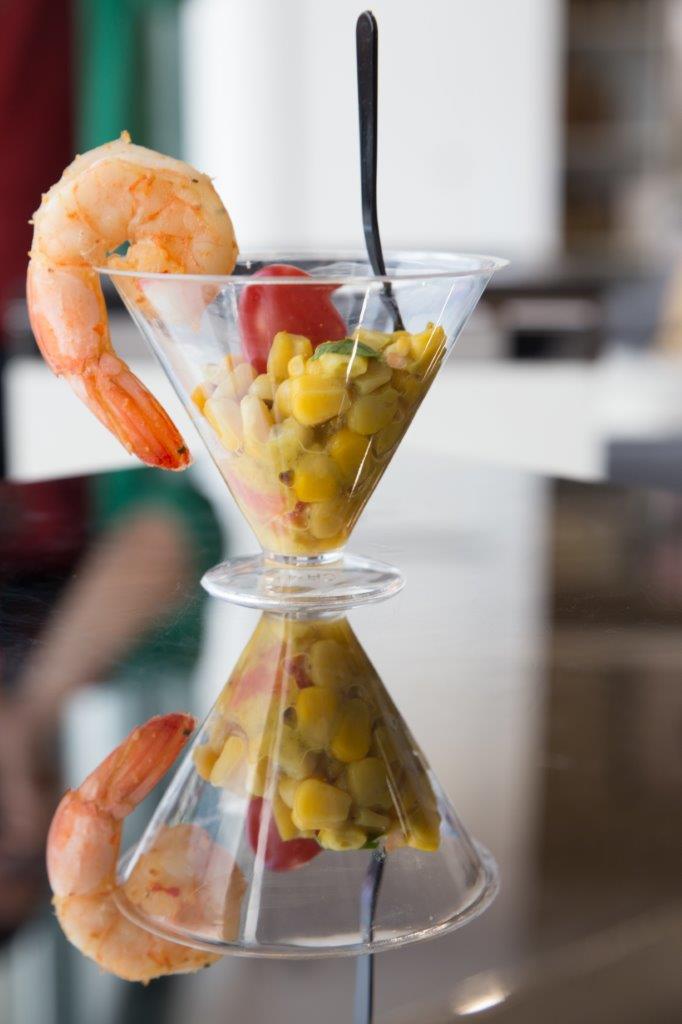 shrimp tomato corn on a table