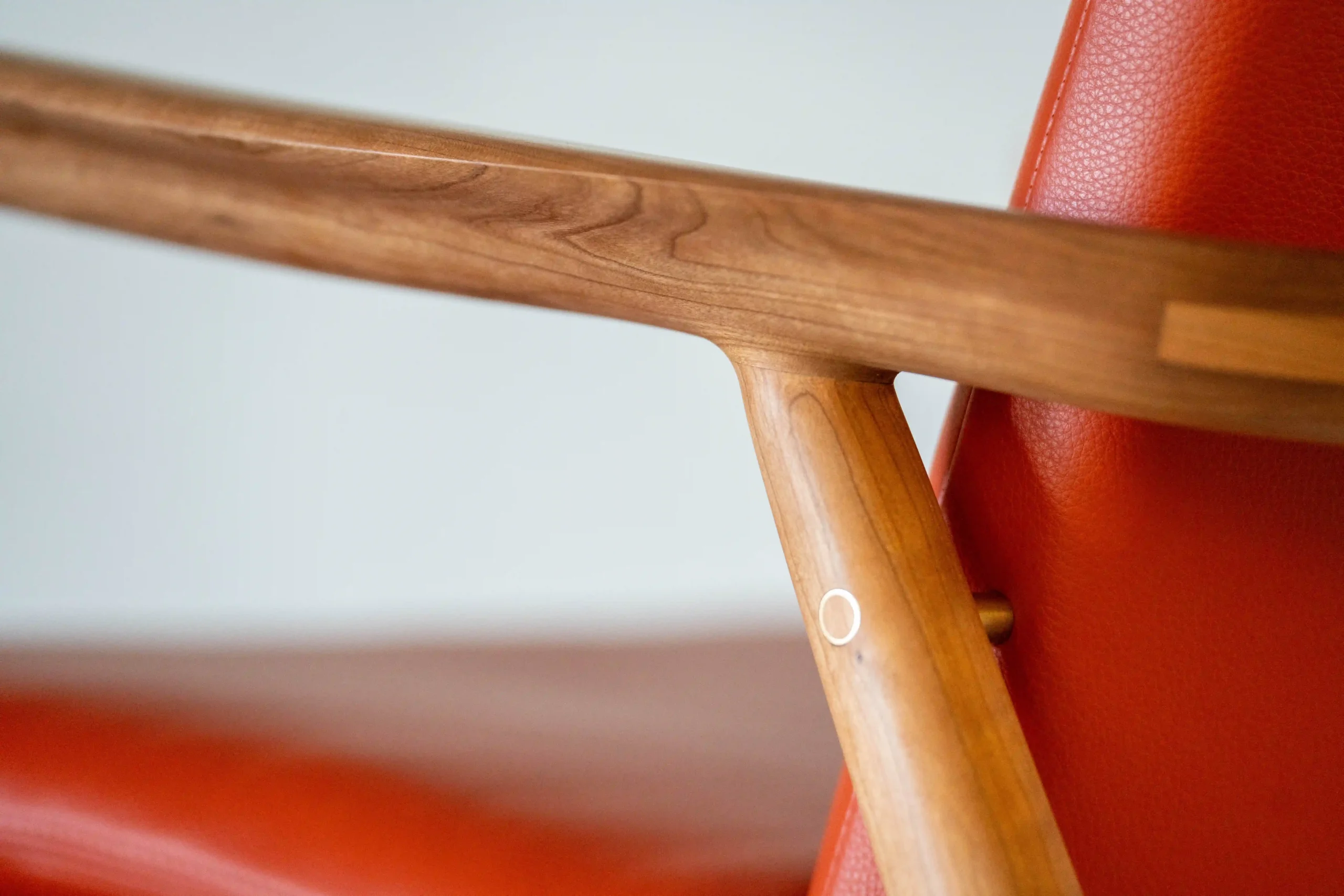Close up photo of wood arm of chair furniture